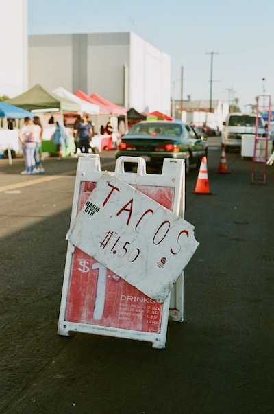 sign advertising tacos