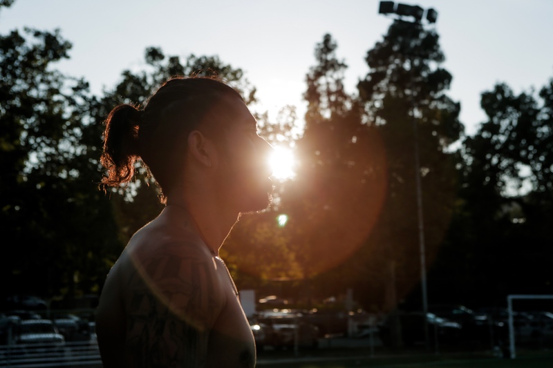 Profile of Flaco's face in a park.