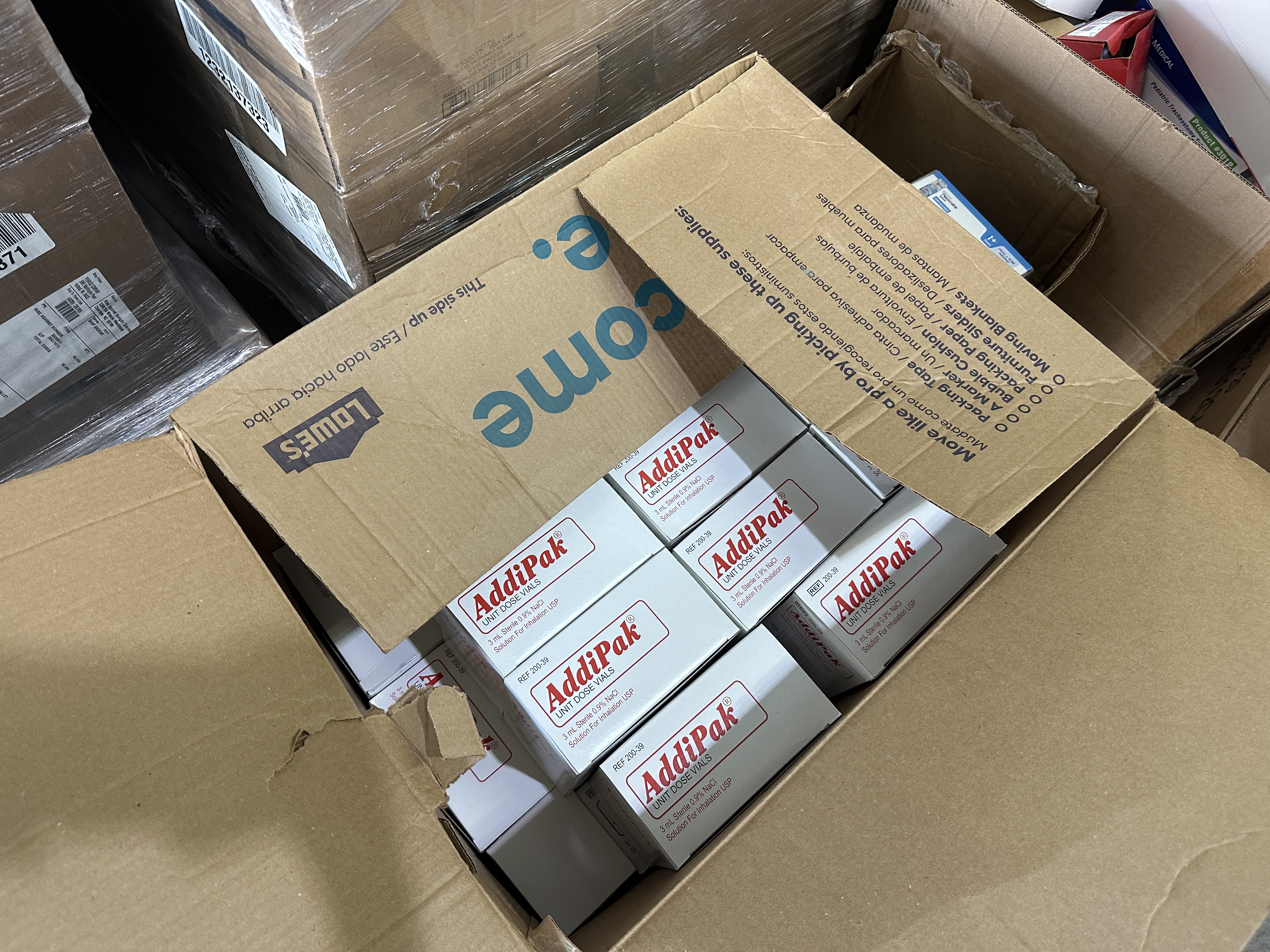 Boxes of saline solution for inhalation therapy inside cardboard box