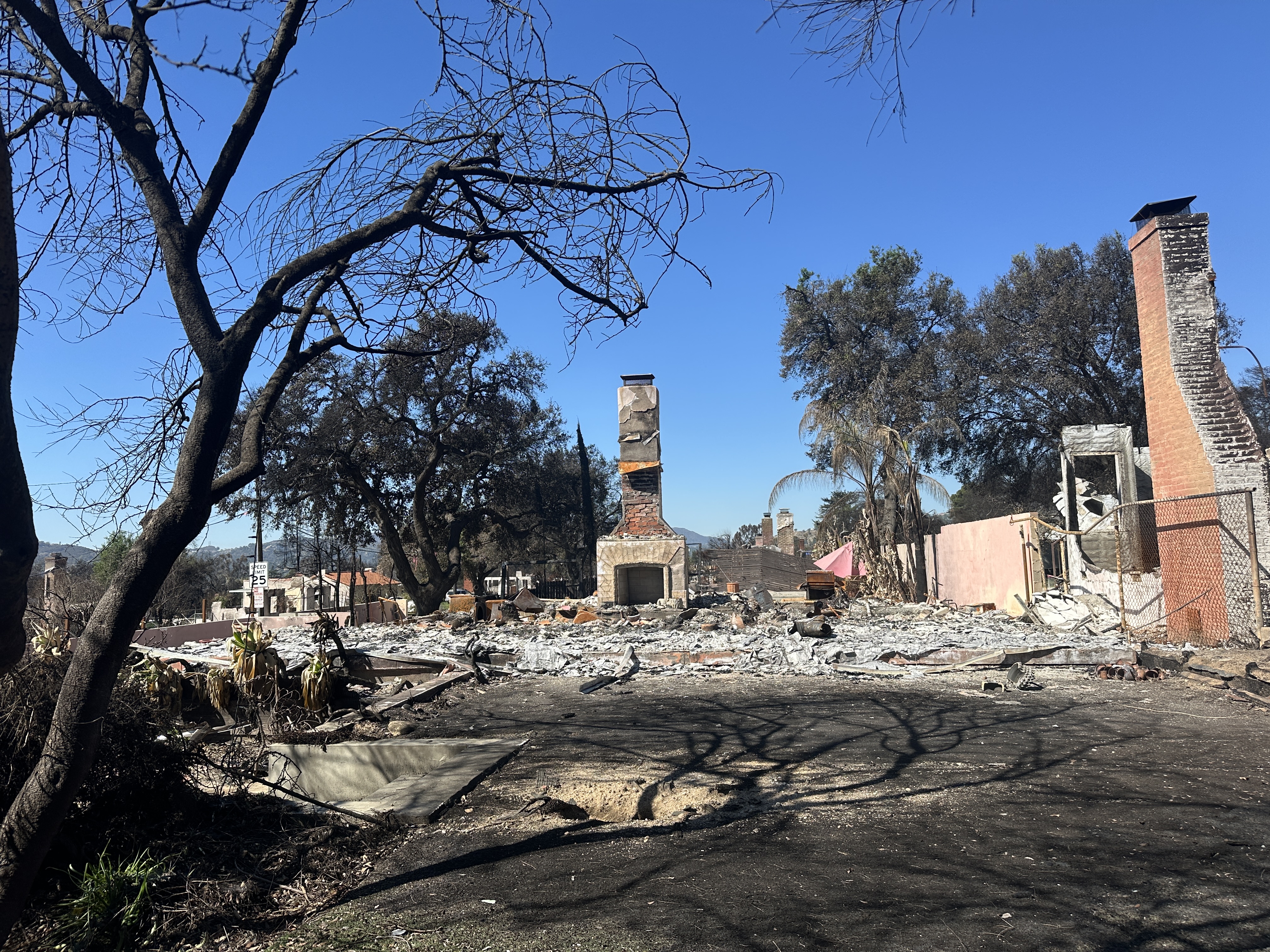 Burned home in Altadena with nothing left but chimney standing