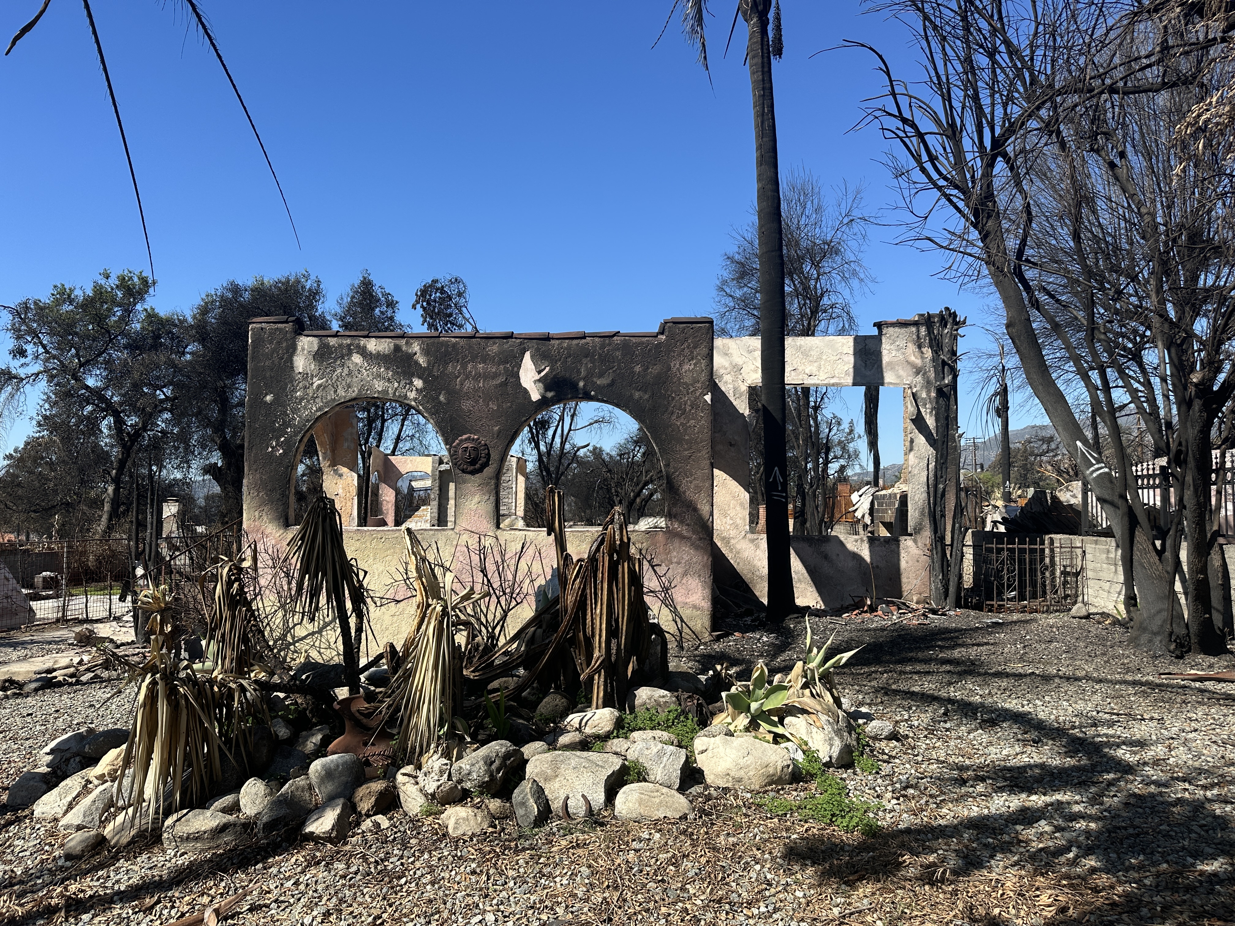 Burned home with nothing left but a few scorched walls