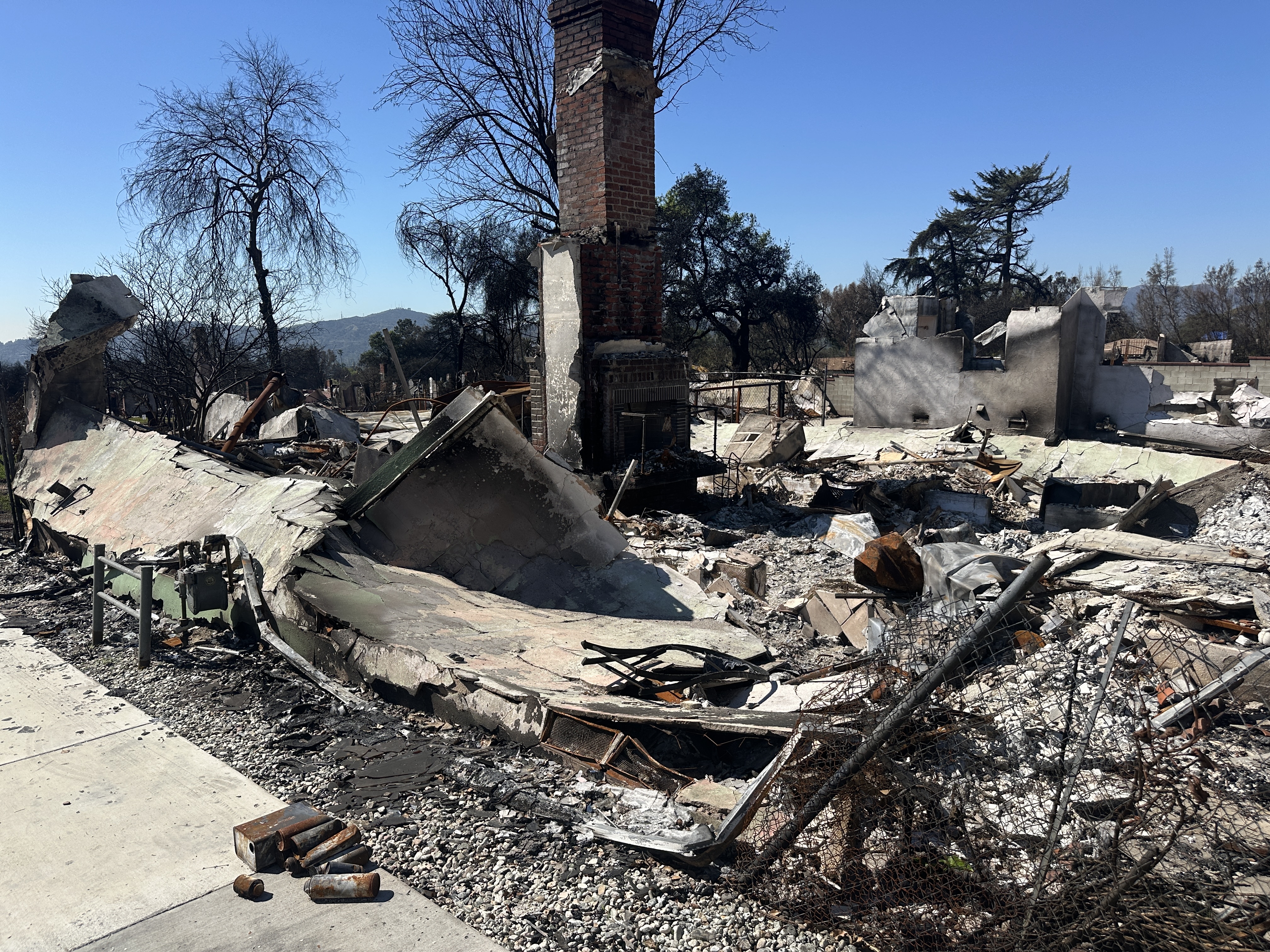 Burned home in Altadena with nothing left but chimney standing